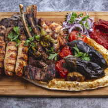 kebab platter with lamb and chicken lula and tikka kebabs grilled vegetables with red onion salad