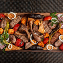assorted-meat-kebab-with-onions-herbs-grilled-vegetables_140725-5629